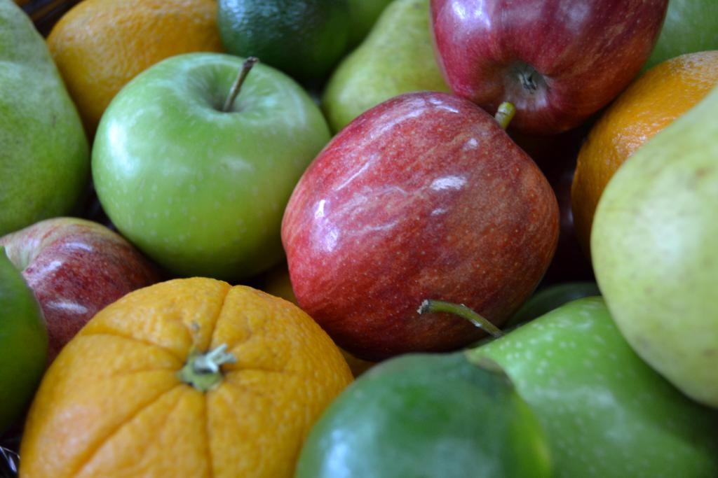 Close-up of fresh mixed fruit including apples, oranges and pears