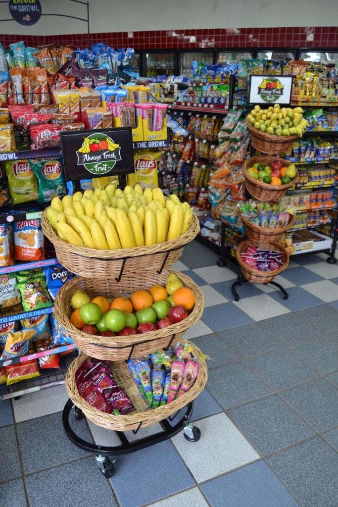 3-tier rolling wicker basket display with bananas and mixed fruit