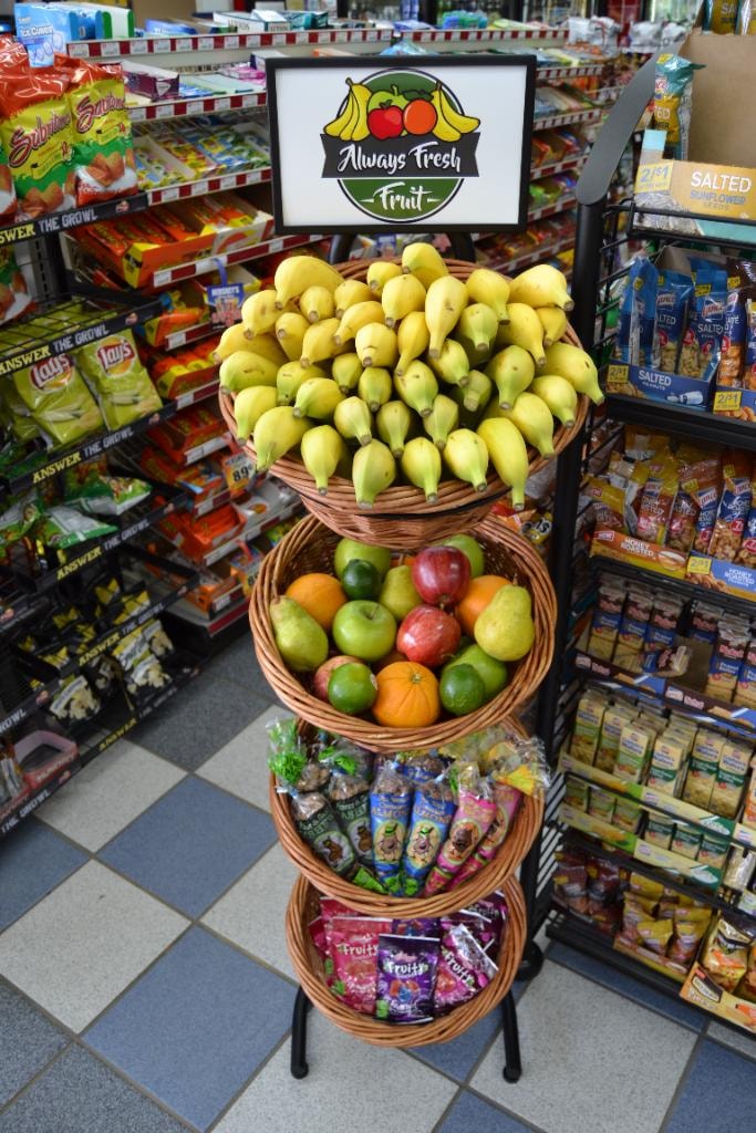 4-tier basket display with bananas and Always Fresh Fruit sign