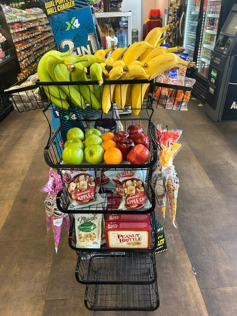 Shopping cart stacked with fresh produce